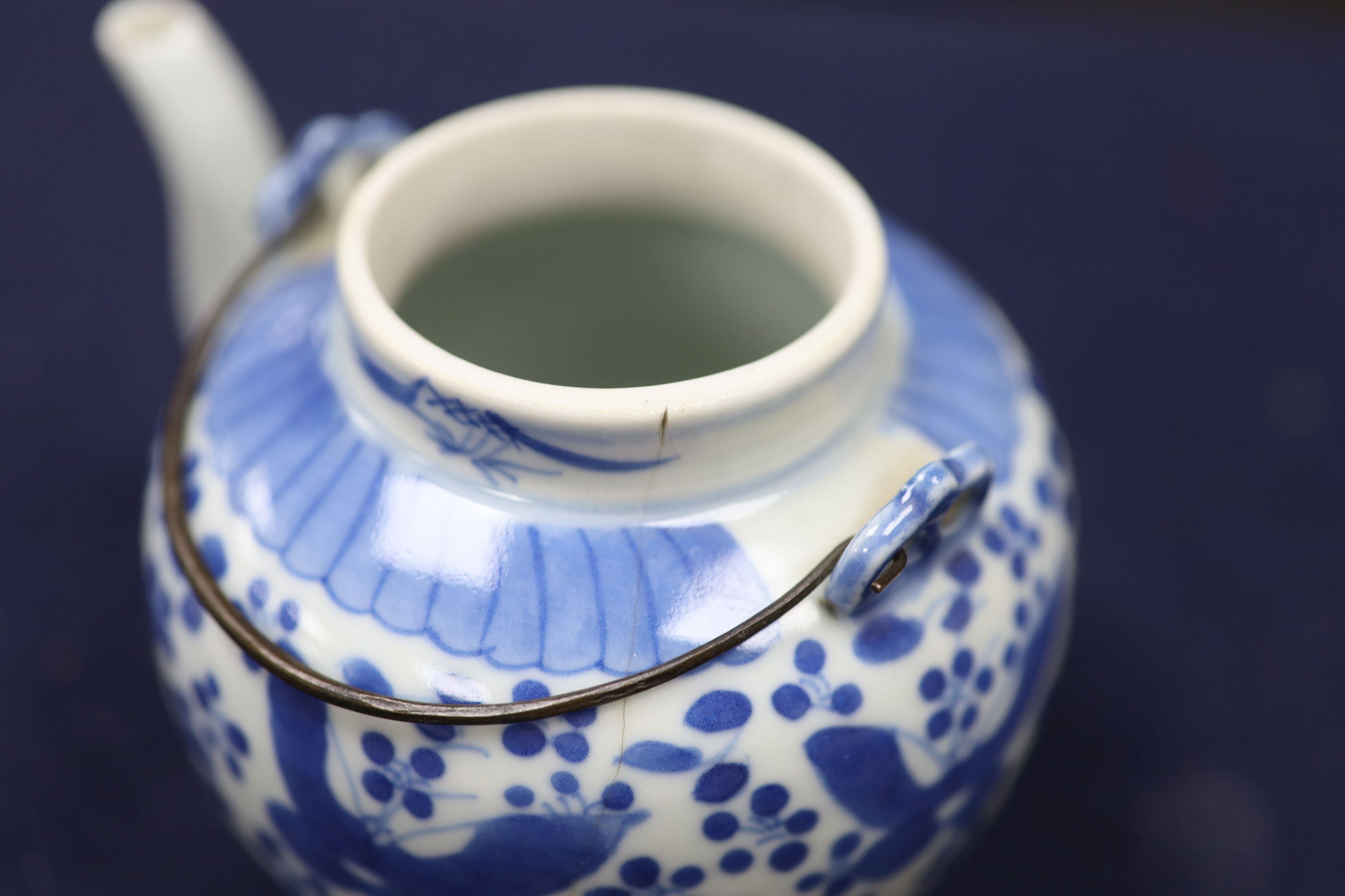 Two 19th century Chinese blue and white moon flasks and a teapot, tallest 21cm